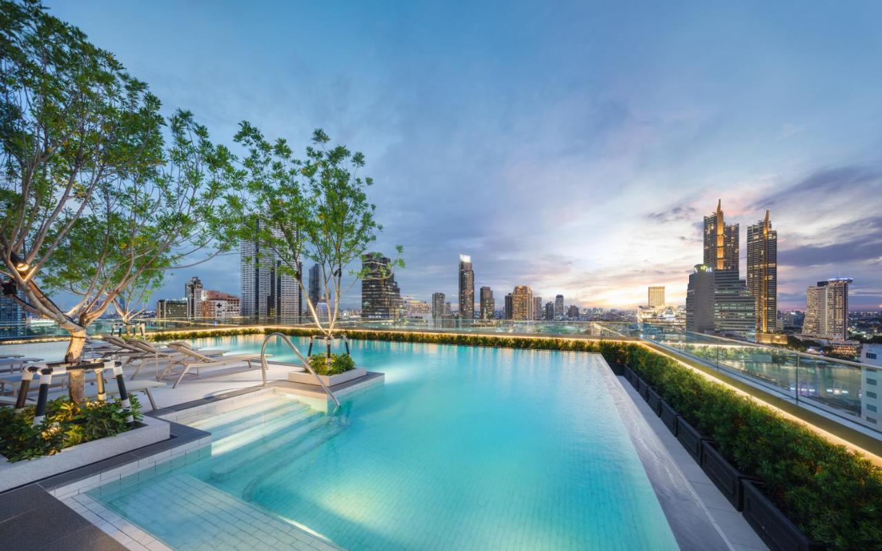 Grande Centre Point Surawong Bangkok Hotel Exterior foto The rooftop pool at The River